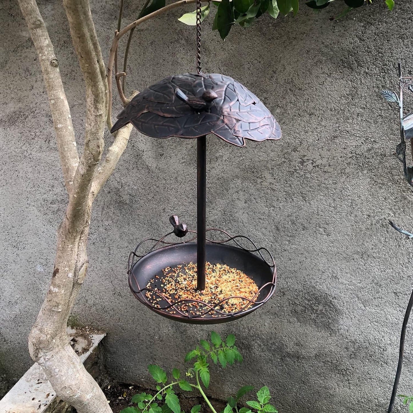 Metal bird feeder is used for outdoor suspension